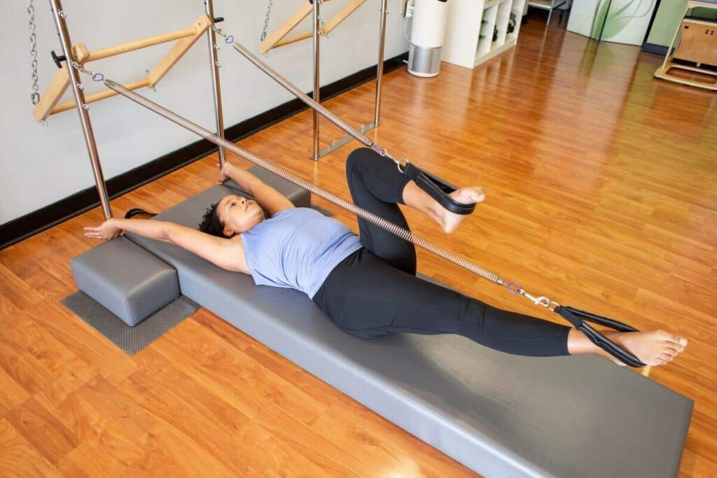 Person using CenterLine Pole System for Pilates exercise