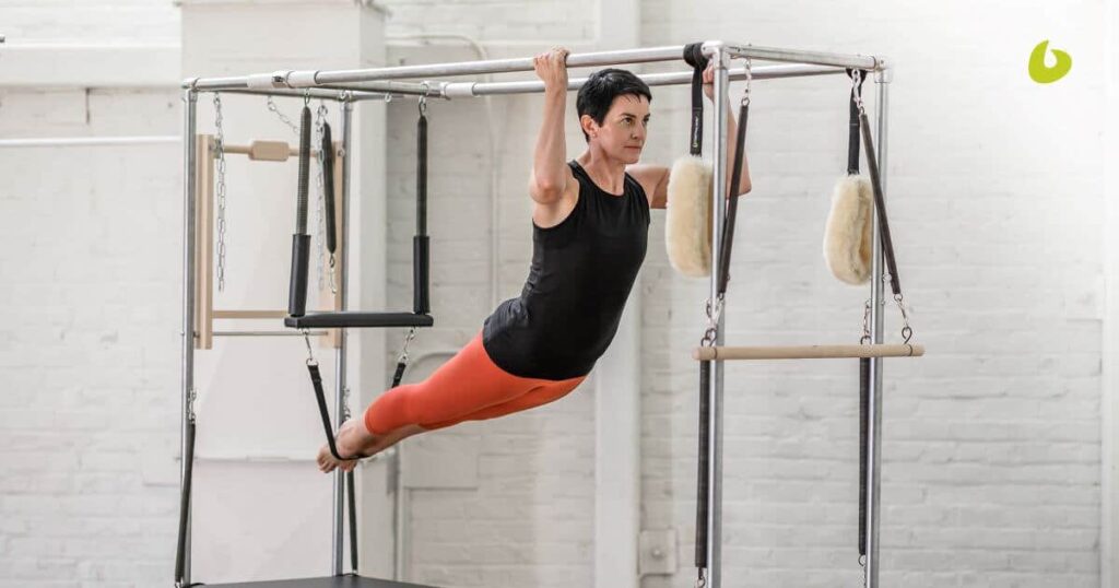Person using cotton web straps on Cadillac trapeze table.